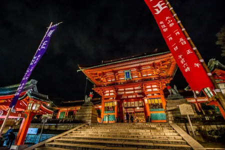 Stunning Japanese temple illuminated at night with warm traditional lighting and architectural details